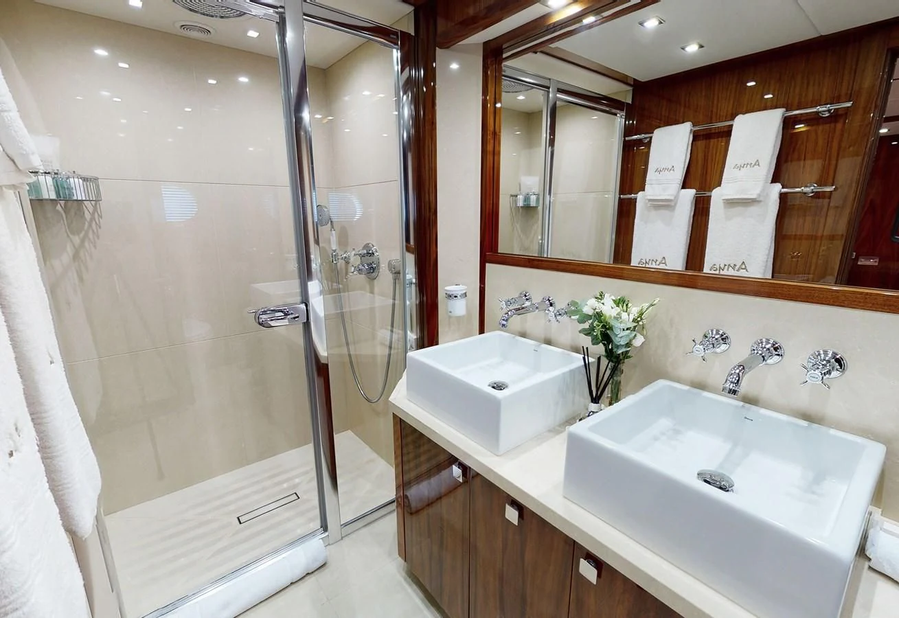 a bathroom with a sink and a shower aboard ANYA Yacht for Sale