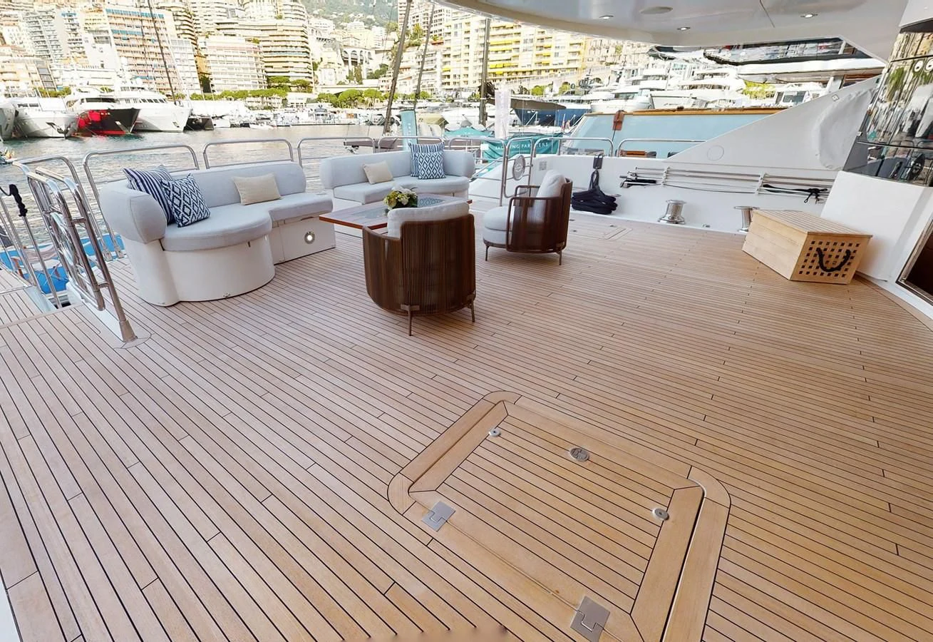 a deck with a deck and chairs aboard ANYA Yacht for Sale