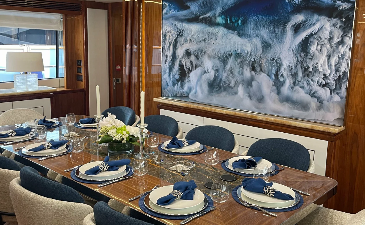 a dining room with a large painting aboard ANYA Yacht for Sale