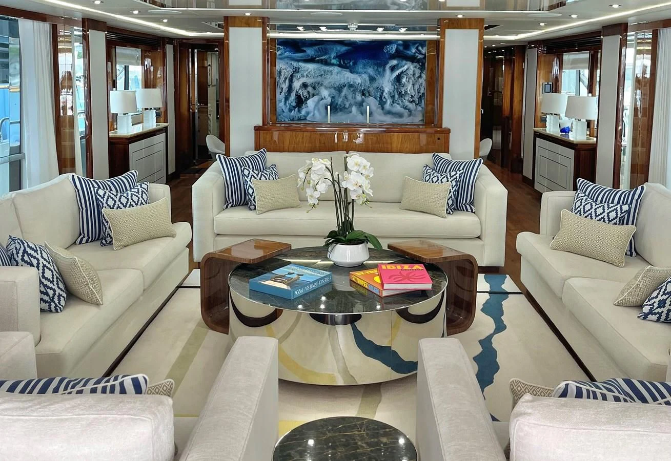 a living room with white couches and a table aboard ANYA Yacht for Sale