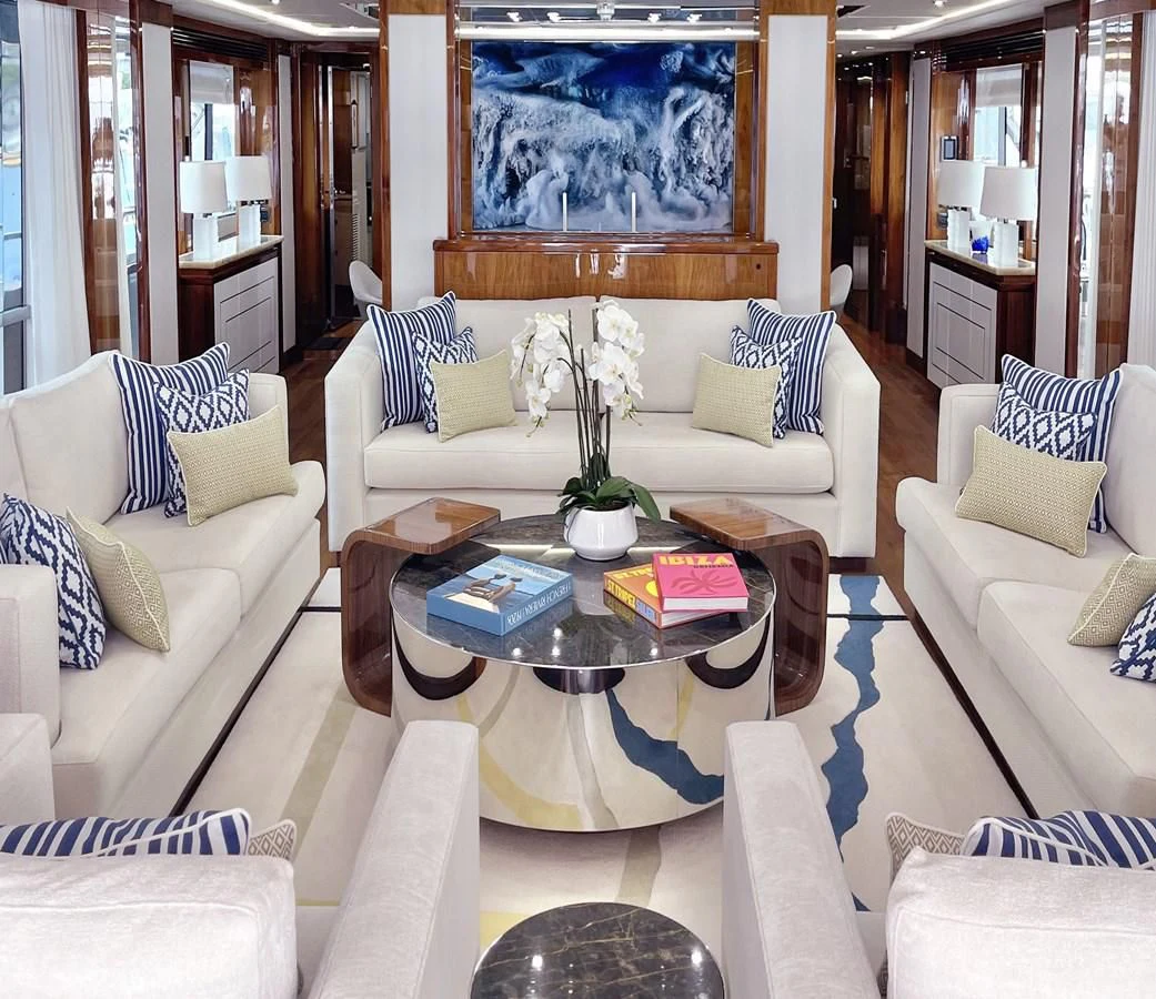 a living room with a white couch and a coffee table aboard ANYA Yacht for Sale