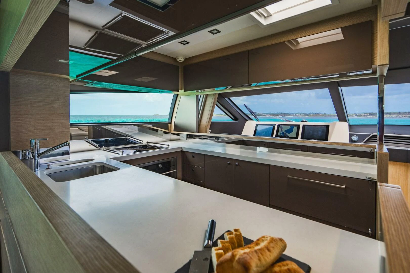 a room with a large window and a desk with a computer on it aboard KUDU Yacht for Sale
