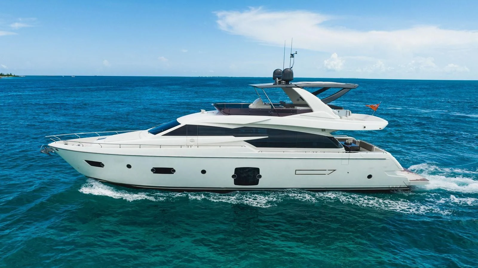 a white yacht in the water aboard KUDU Yacht for Sale