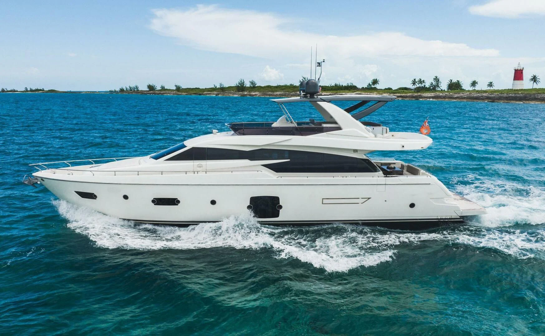 a white yacht on the water aboard KUDU Yacht for Sale