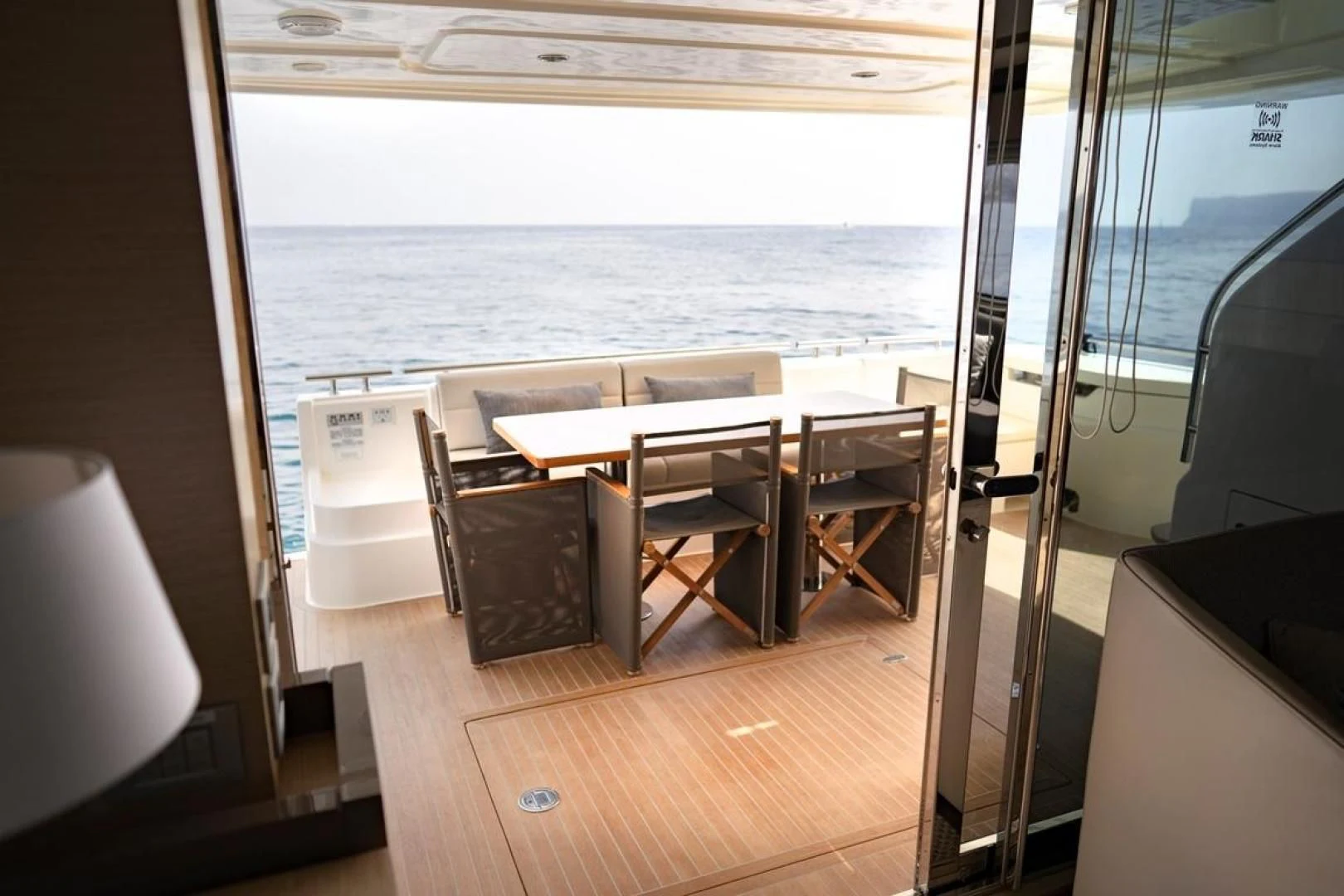a room with a table and chairs aboard KUDU Yacht for Sale