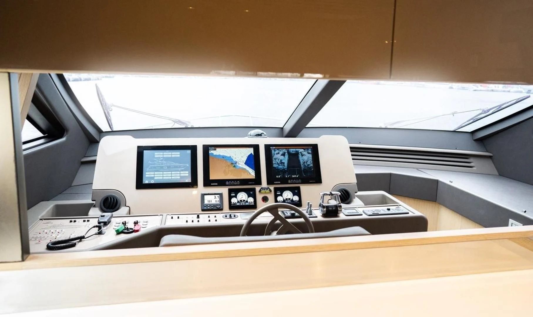 a computer monitor and keyboard on a desk aboard KUDU Yacht for Sale