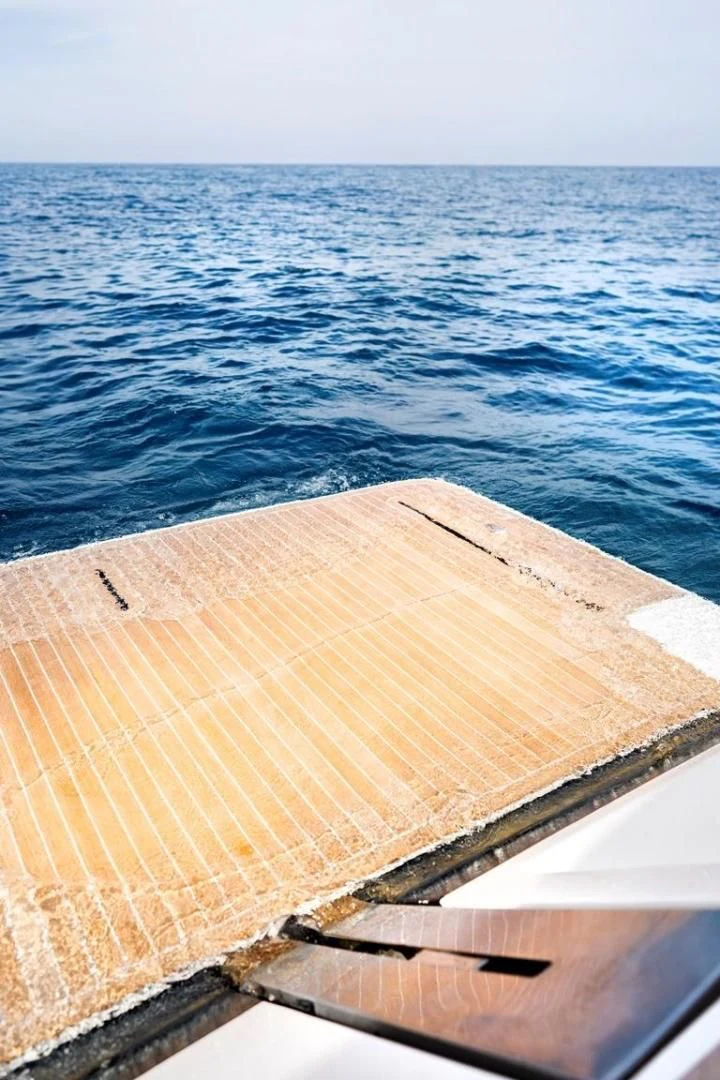 a wooden boat on the water aboard KUDU Yacht for Sale