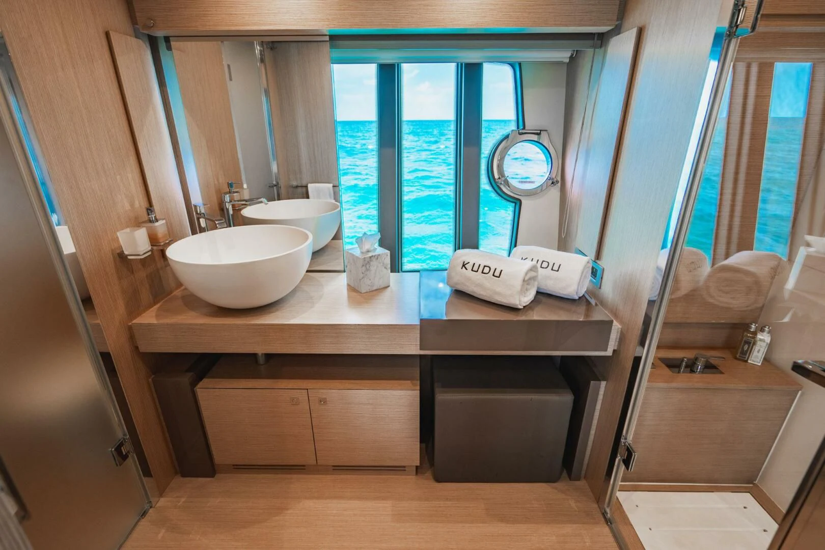 a bathroom with a sink and a mirror aboard KUDU Yacht for Sale