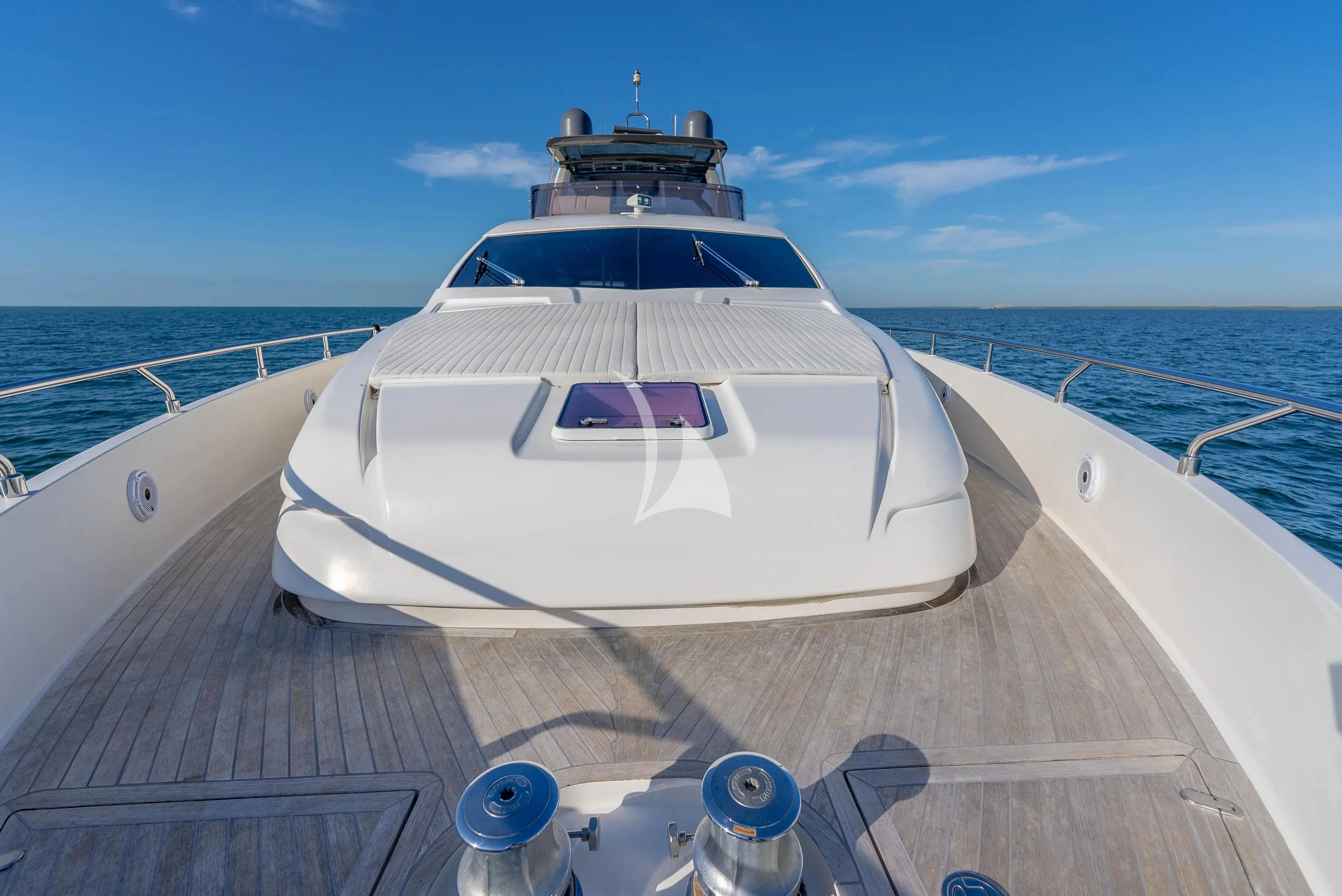 a white yacht on a deck aboard KUDU Yacht for Sale