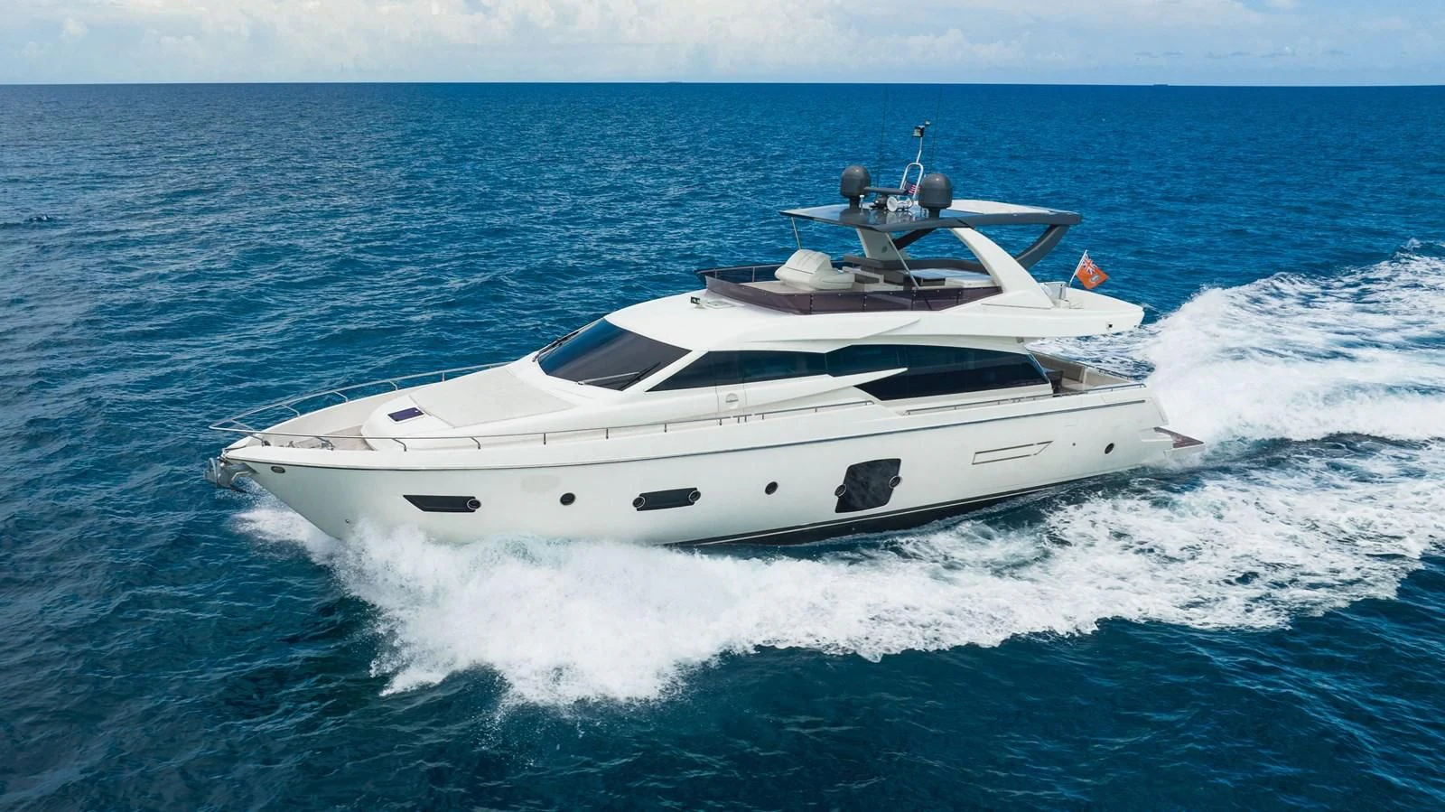 a white yacht on the water aboard KUDU Yacht for Sale