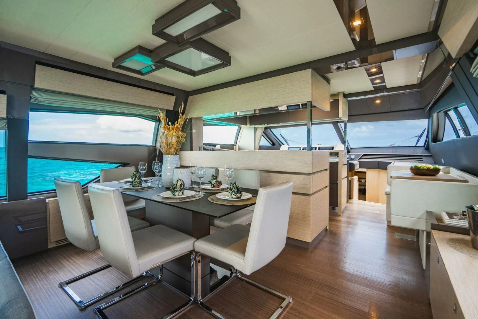 a room with a table chairs and a window aboard KUDU Yacht for Sale