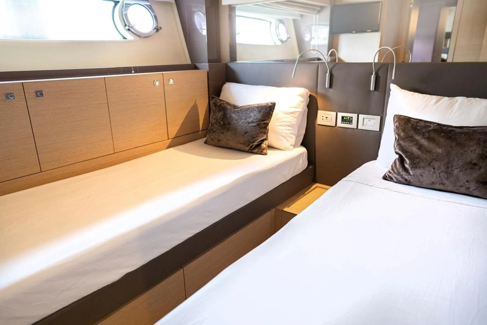 a bed with white sheets aboard KUDU Yacht for Sale