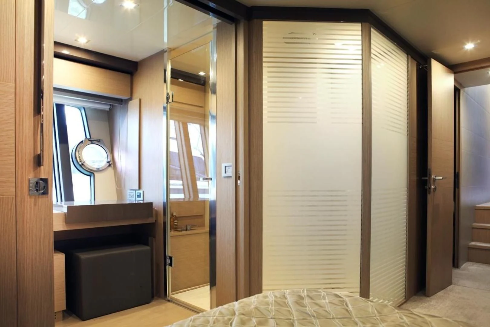 a room with a bed and a closet aboard KUDU Yacht for Sale