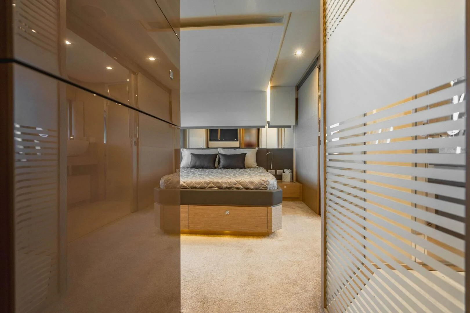 a room with a bed and a chair aboard KUDU Yacht for Sale