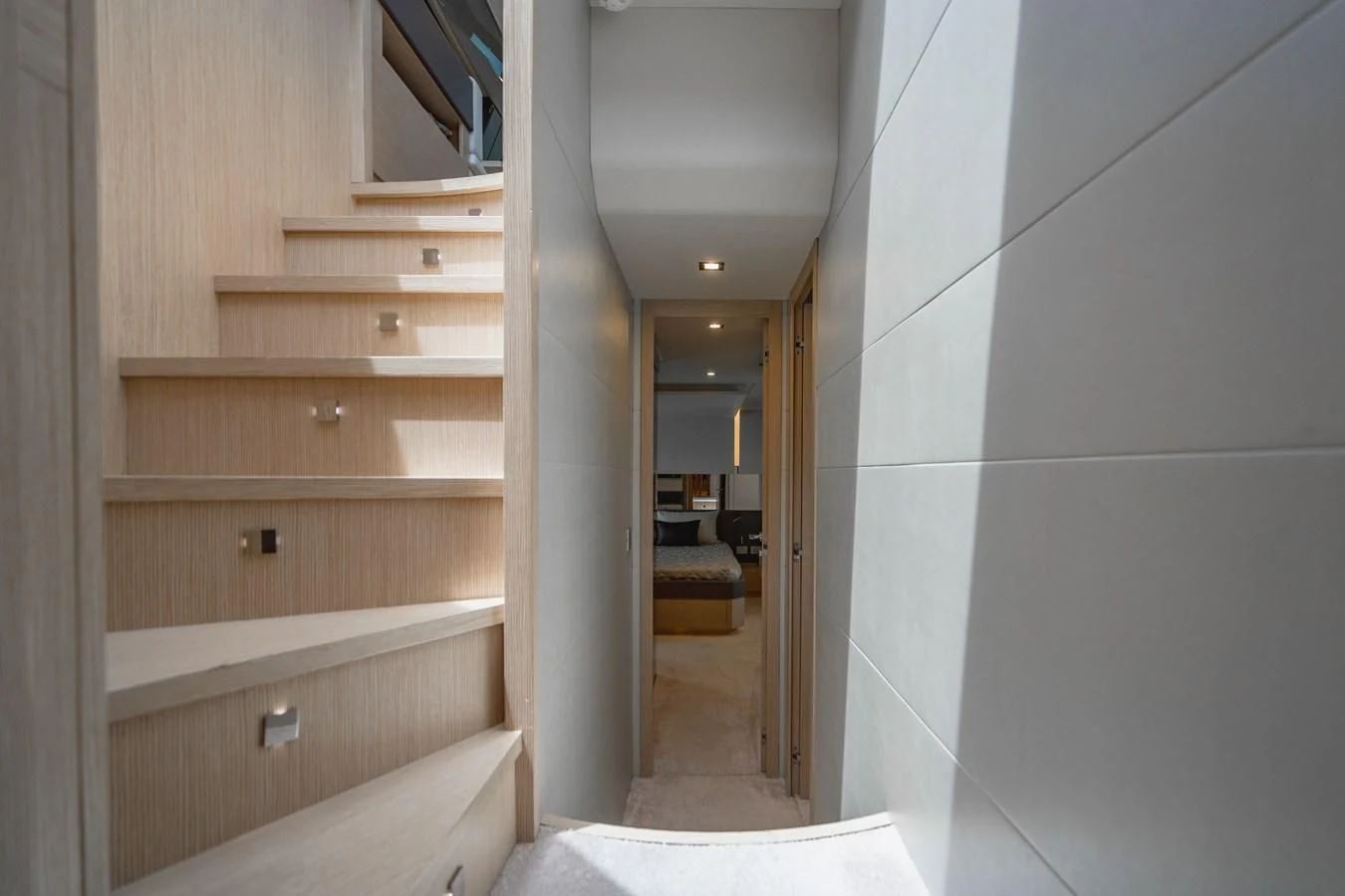 a hallway with a wood cabinet aboard KUDU Yacht for Sale
