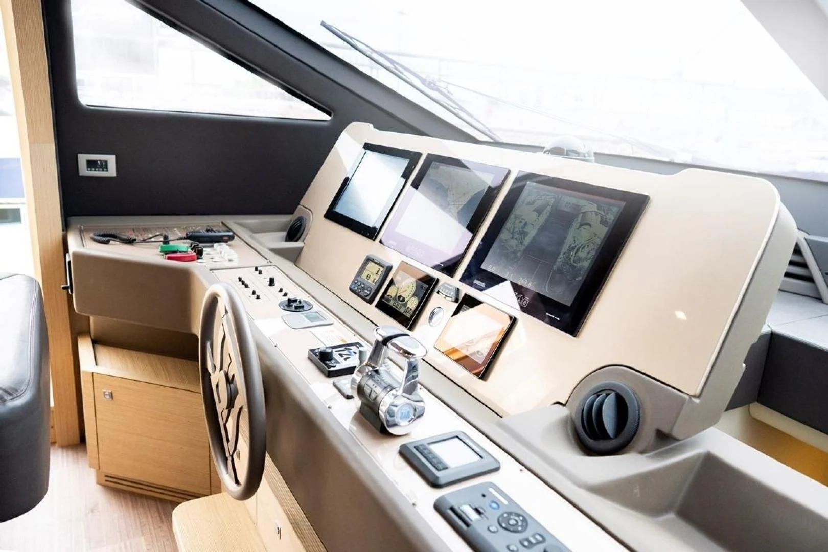 a white desk with a computer and a television on it aboard KUDU Yacht for Sale