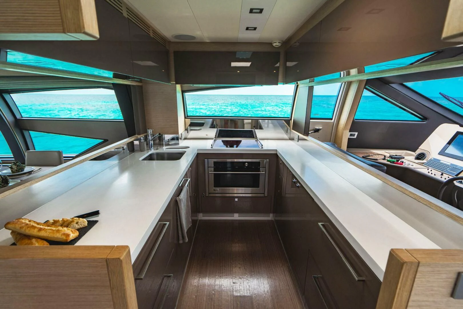 a kitchen with a tv and a grill aboard KUDU Yacht for Sale