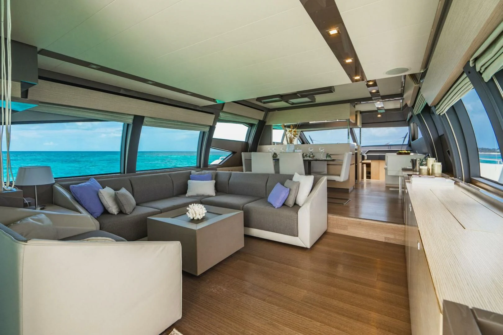 a living room with a large window aboard KUDU Yacht for Sale