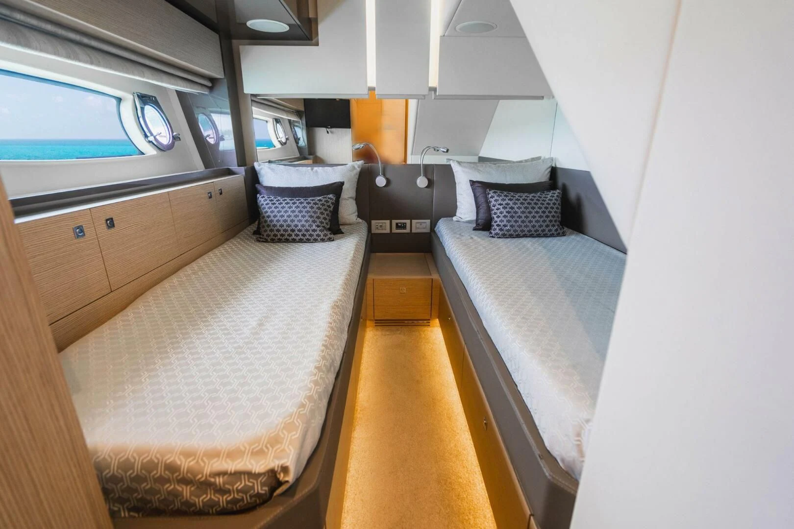 a room with two beds aboard KUDU Yacht for Sale