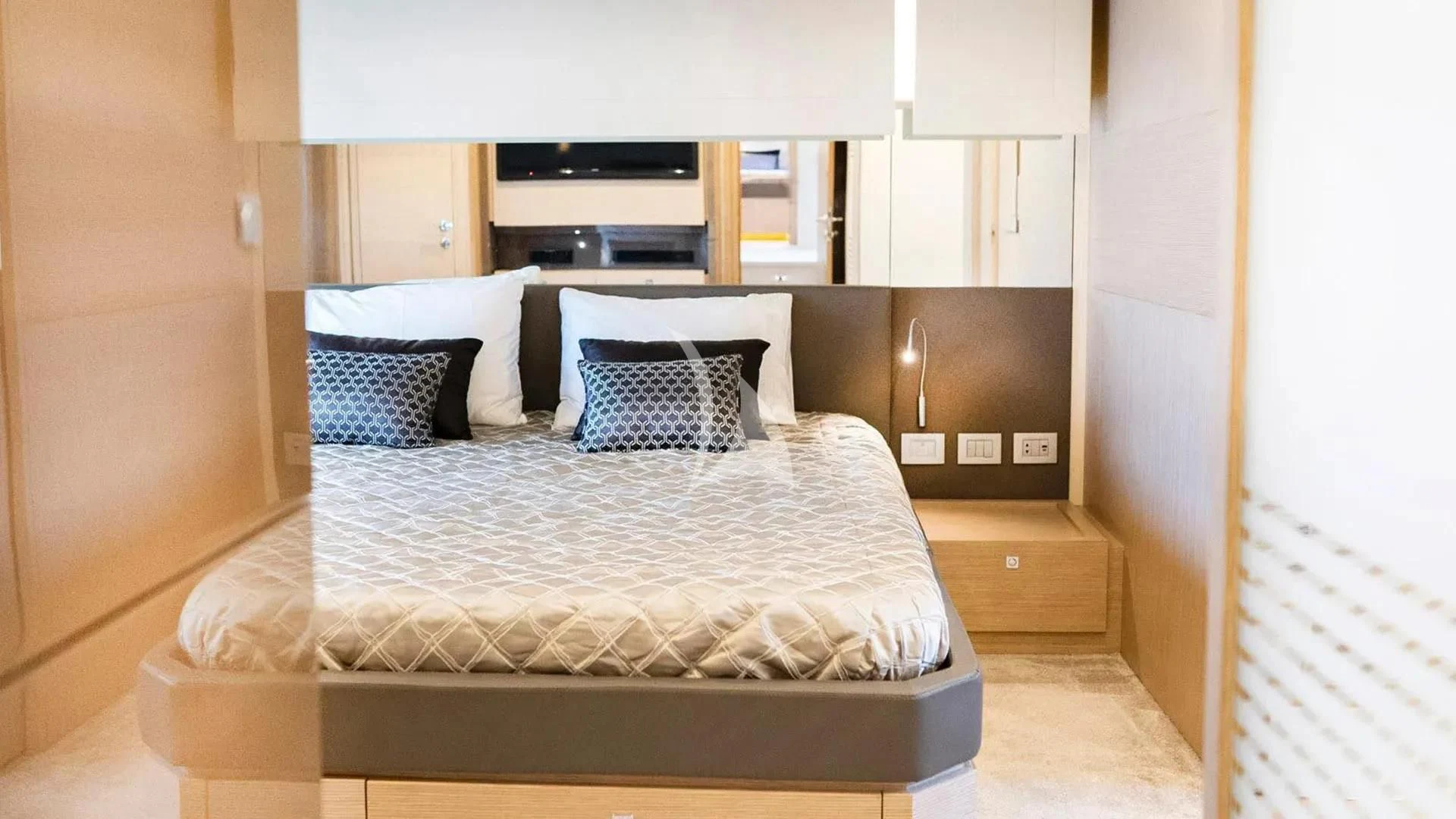a bed in a room aboard KUDU Yacht for Sale