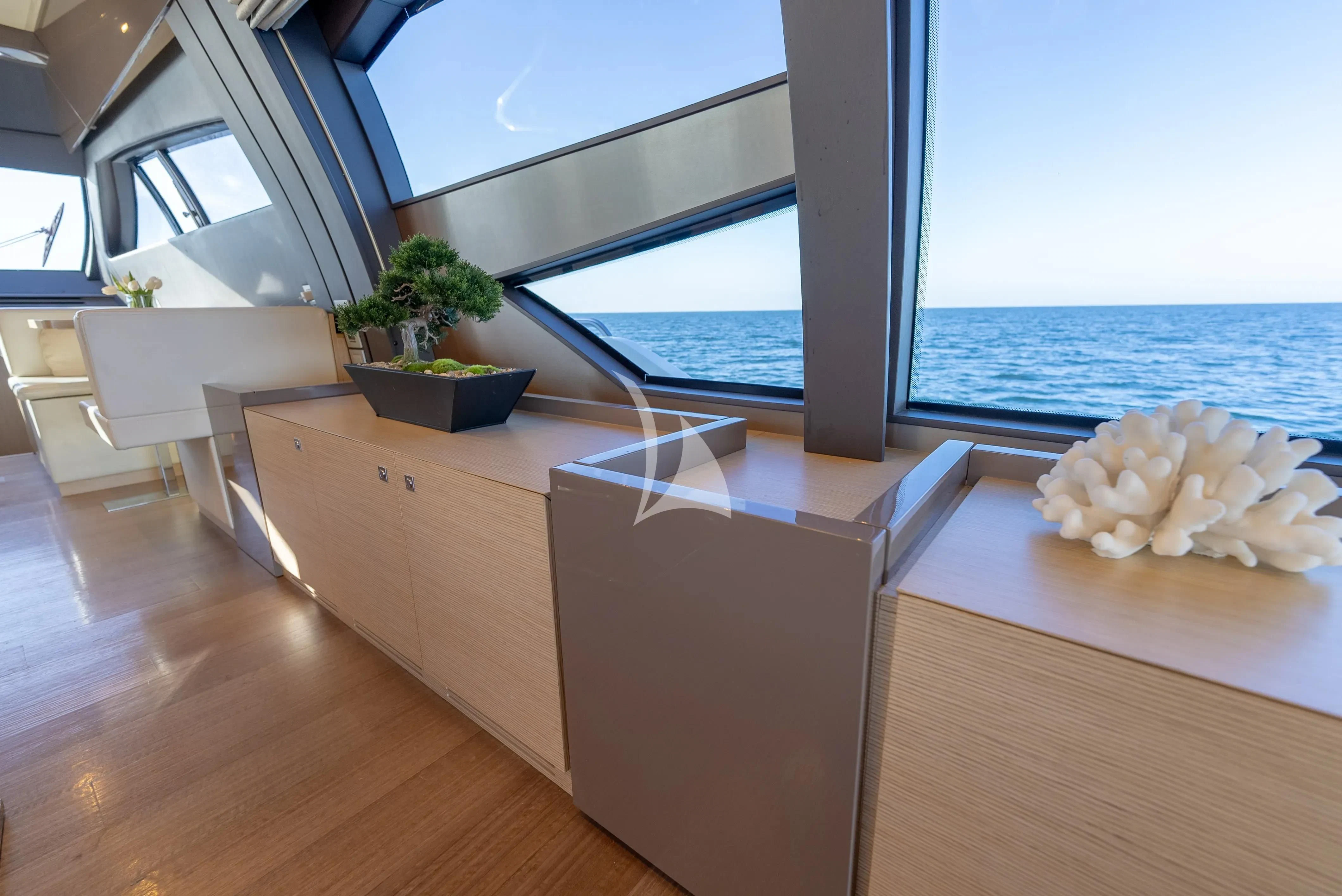 a room with a table and chairs aboard KUDU Yacht for Sale