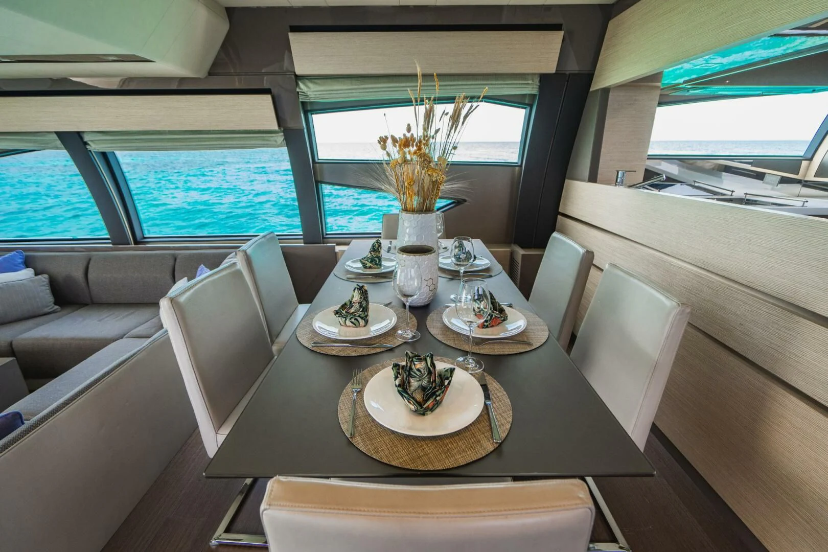 a table with plates and cups on it aboard KUDU Yacht for Sale