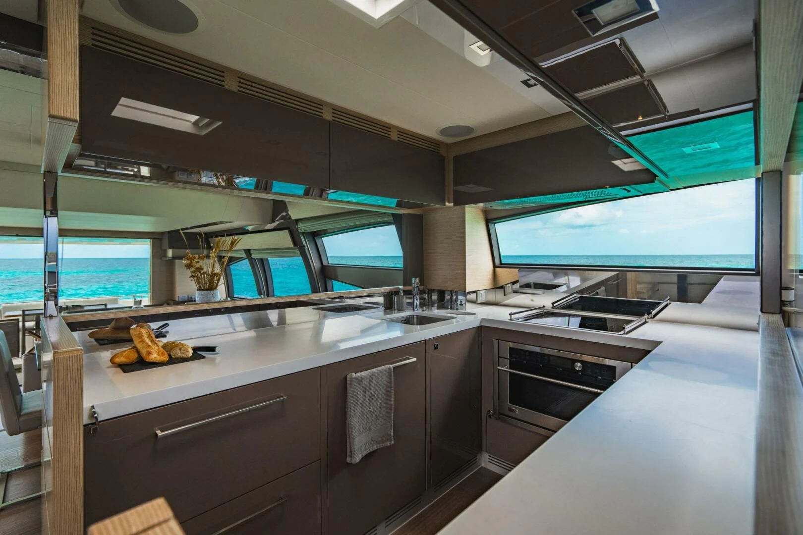 a kitchen with a large window aboard KUDU Yacht for Sale