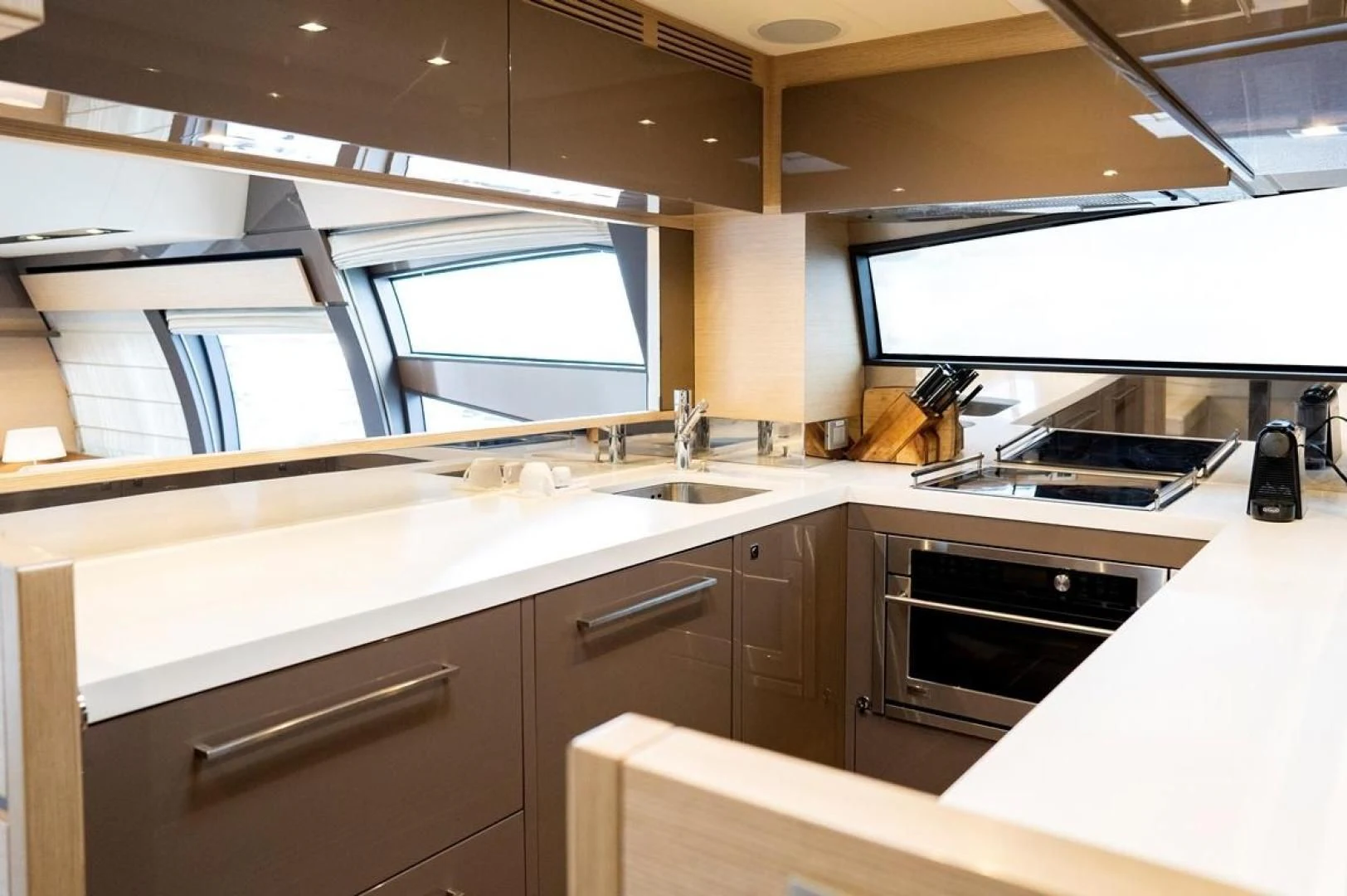 a kitchen with a large window aboard KUDU Yacht for Sale