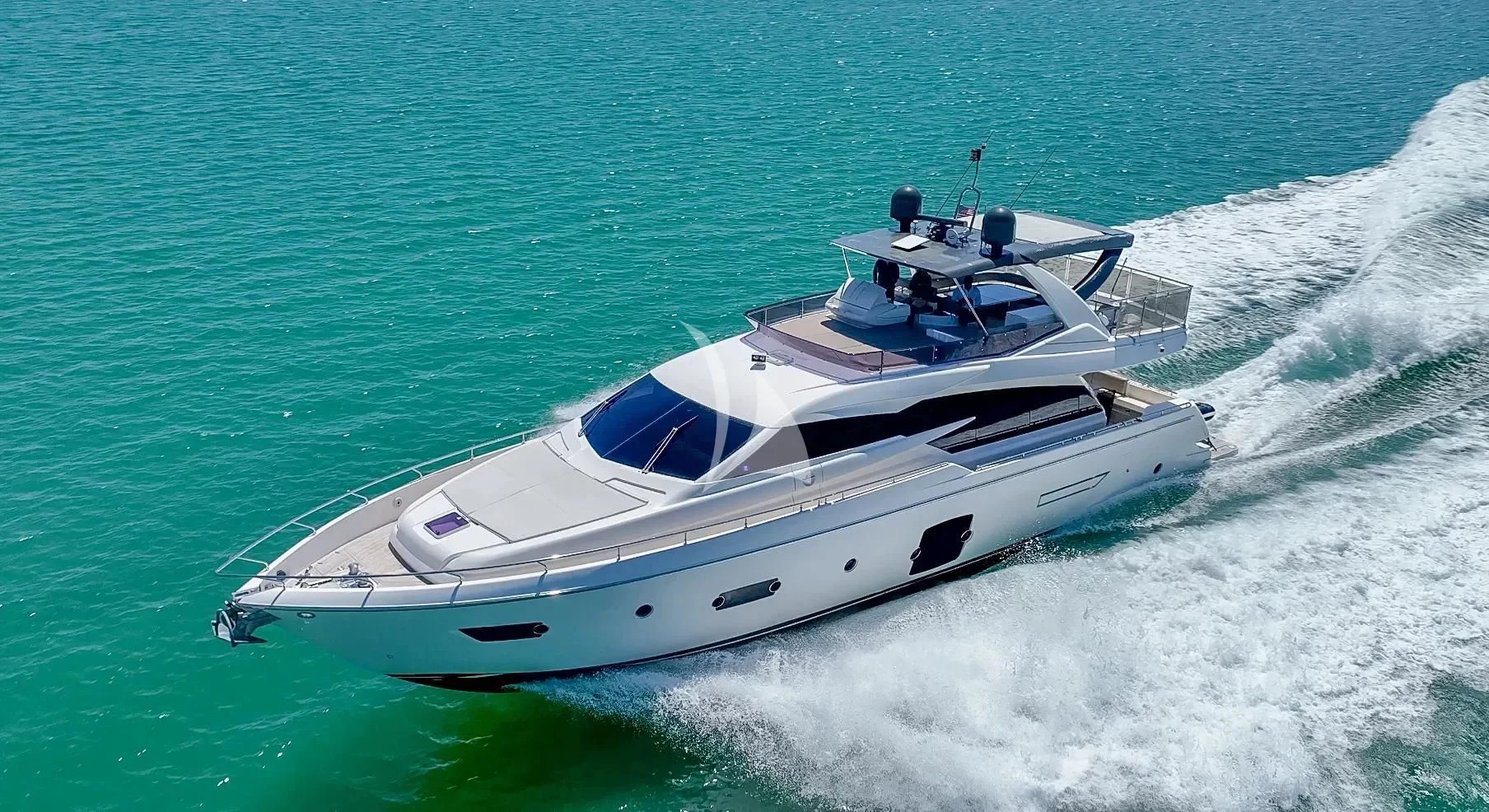 a white yacht on the water aboard KUDU Yacht for Sale