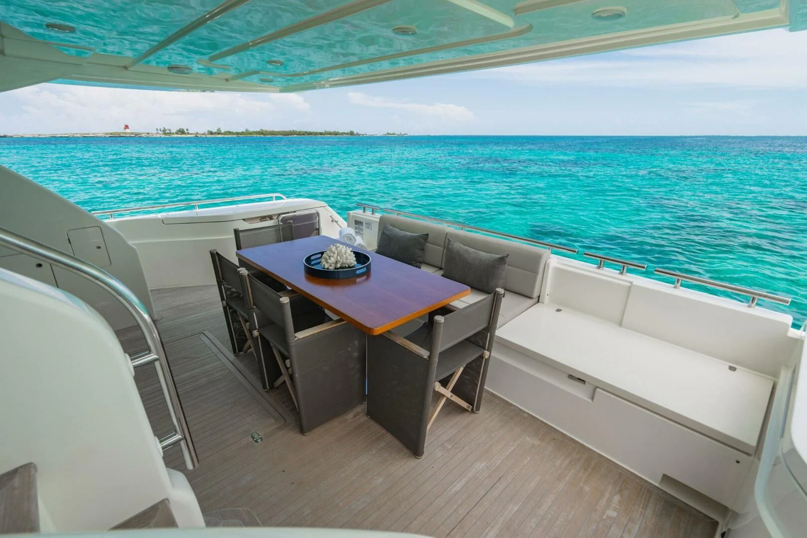 a table and chairs on a boat aboard KUDU Yacht for Sale