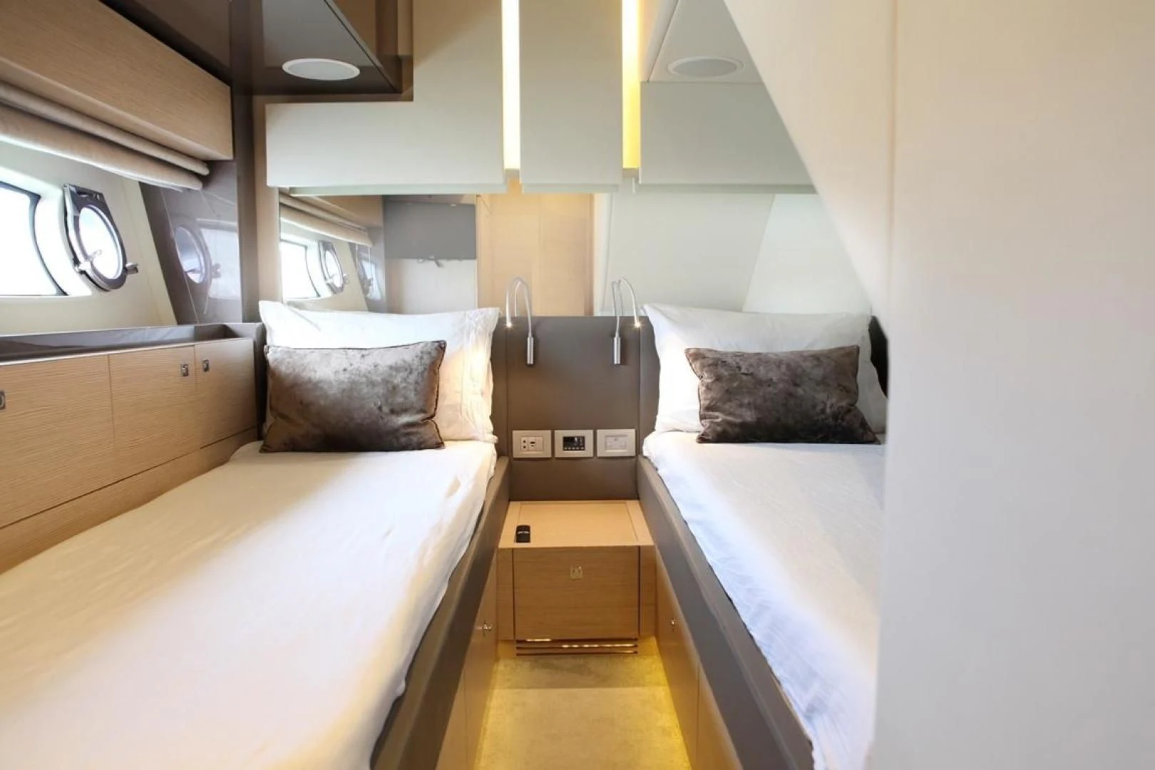 a room with beds and a window aboard KUDU Yacht for Sale