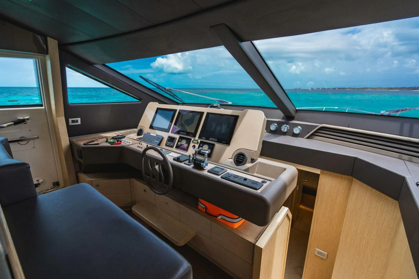 inside of a vehicle with a large window and a view of the ocean aboard KUDU Yacht for Sale
