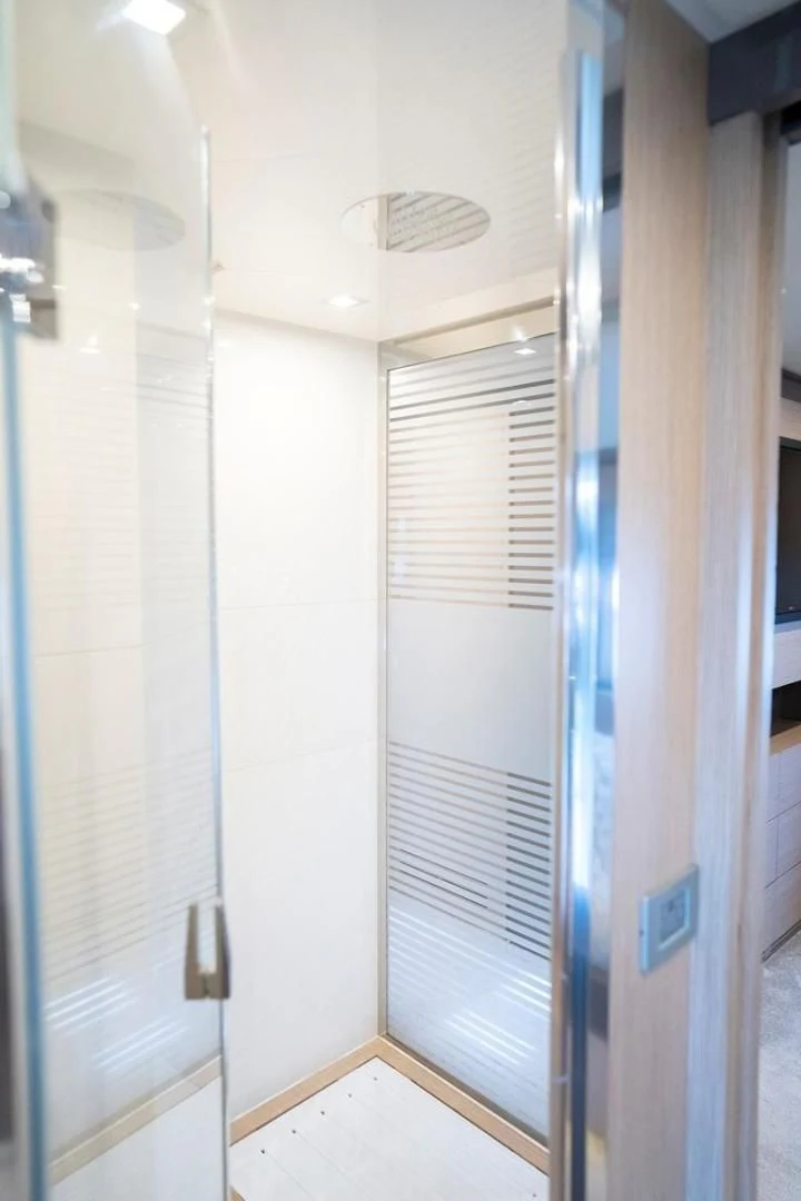 a room with a door and a window aboard KUDU Yacht for Sale