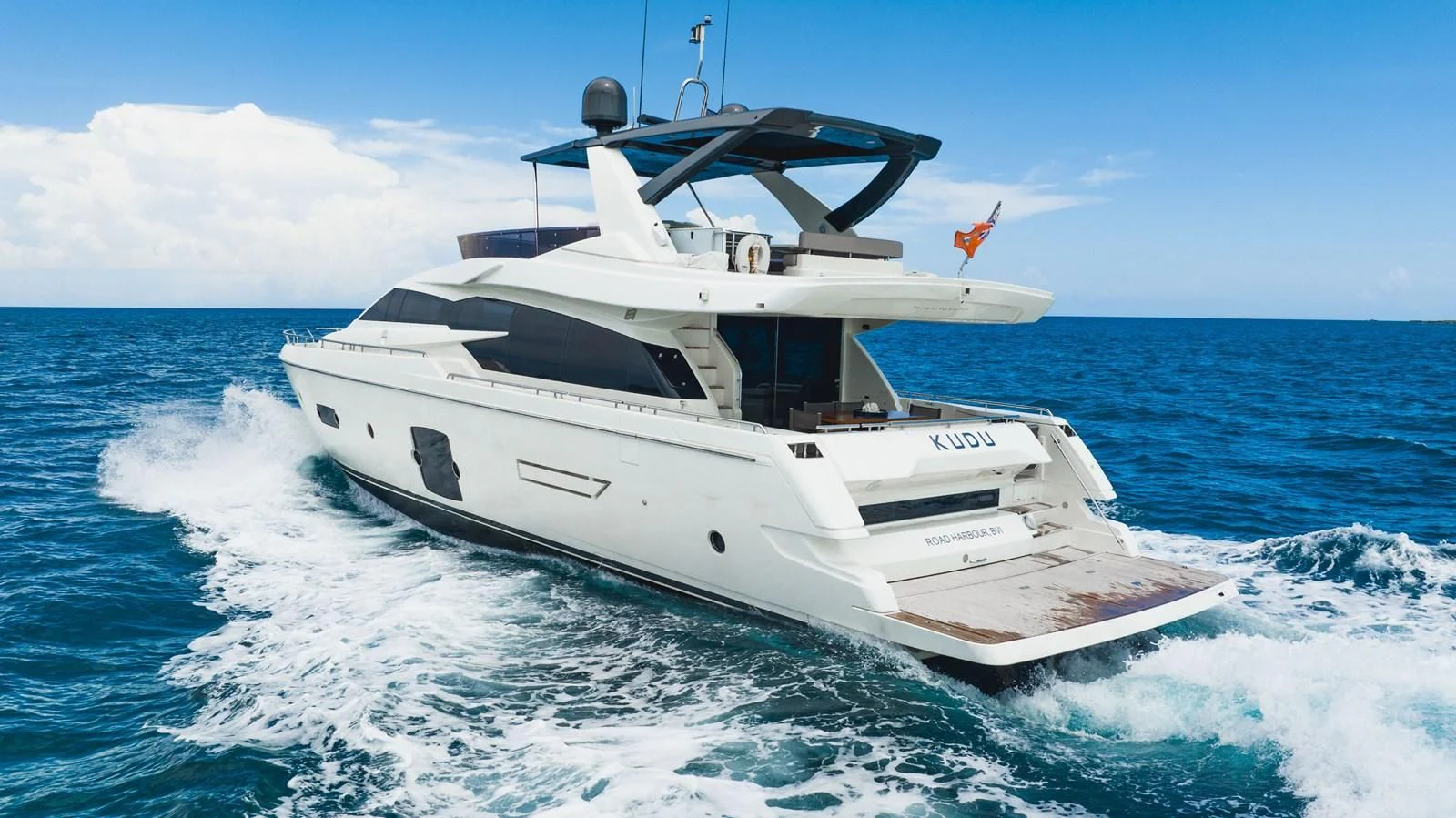 a white yacht on the water aboard KUDU Yacht for Sale