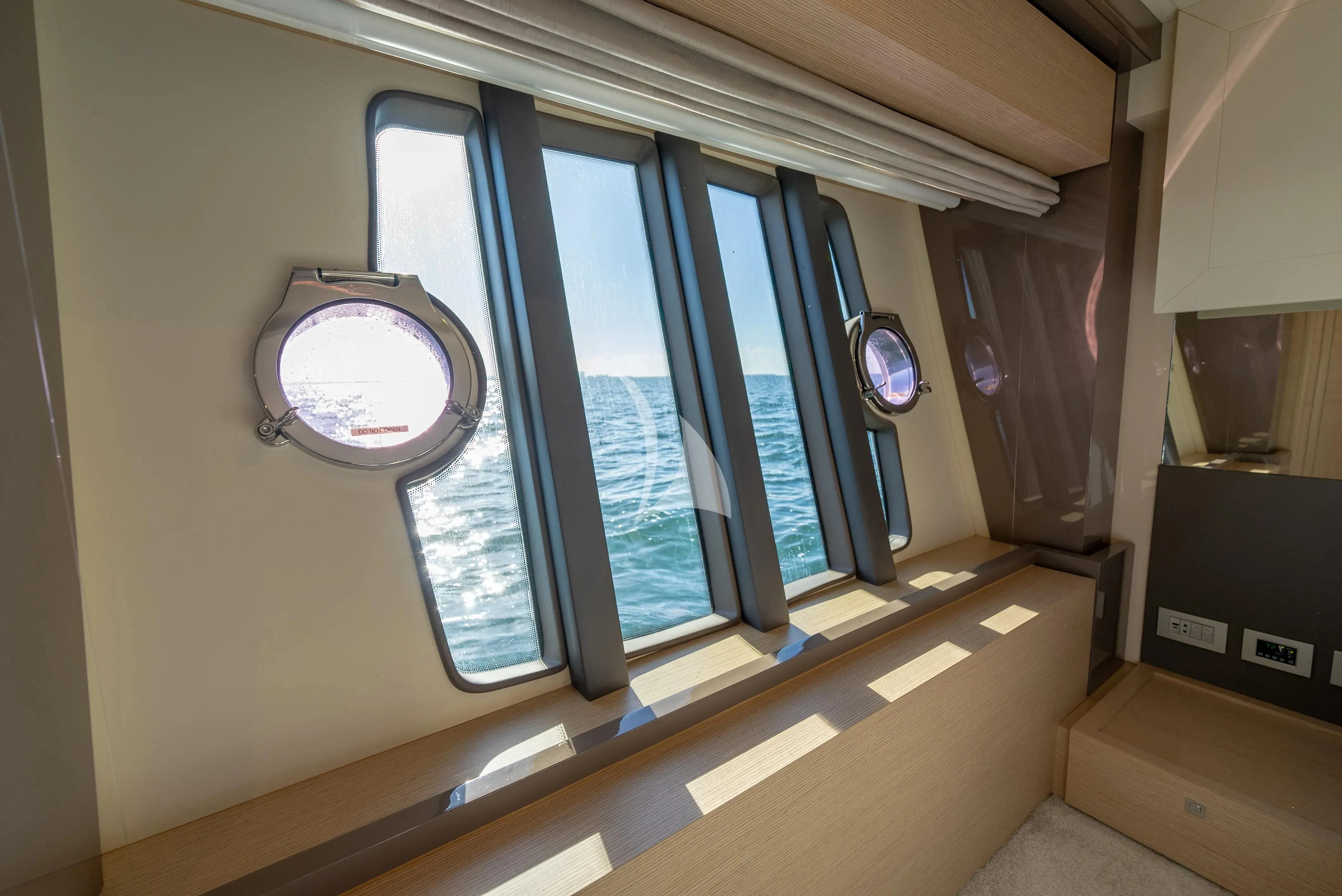 a room with a window and a mirror aboard KUDU Yacht for Sale