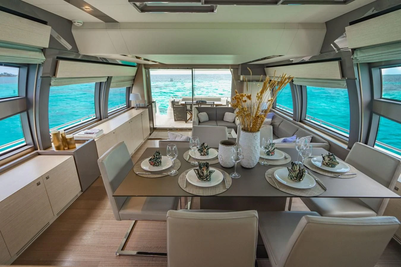 a dining room with a large window aboard KUDU Yacht for Sale