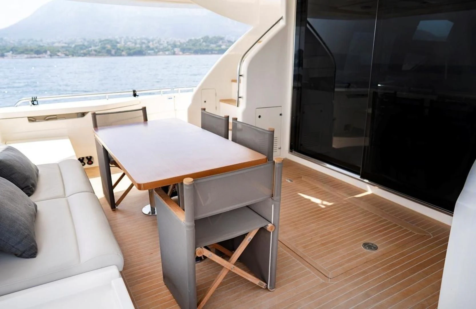 a room with a table and chairs aboard KUDU Yacht for Sale