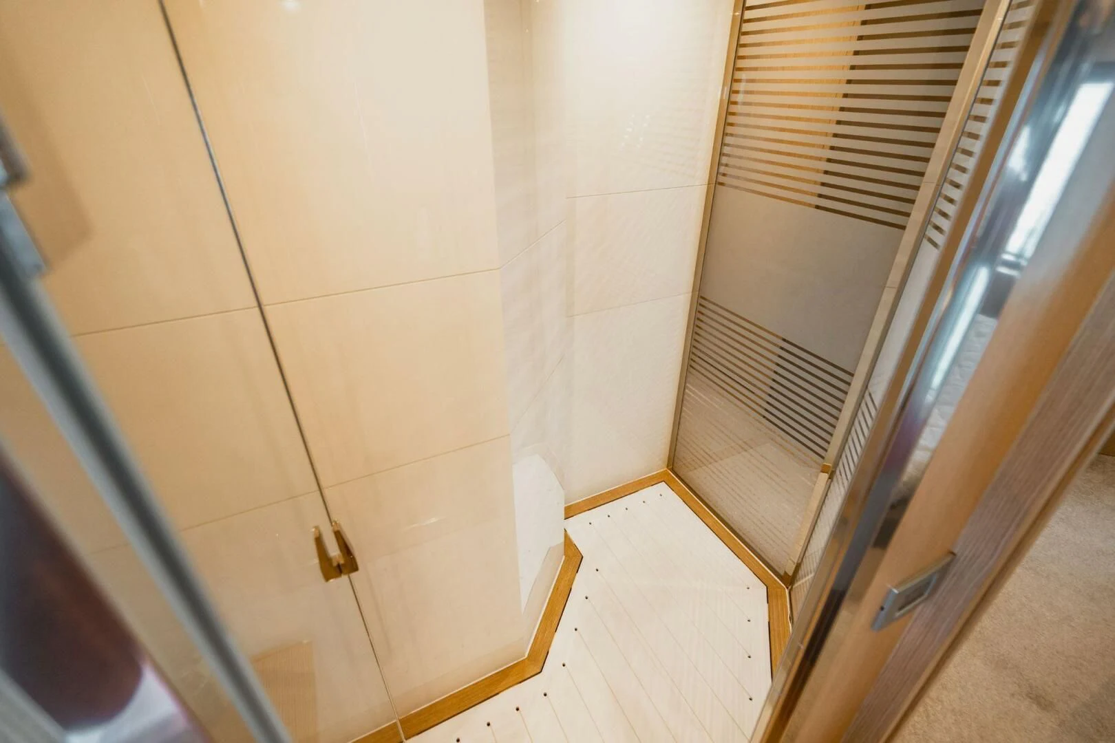 a room with a window and a door aboard KUDU Yacht for Sale