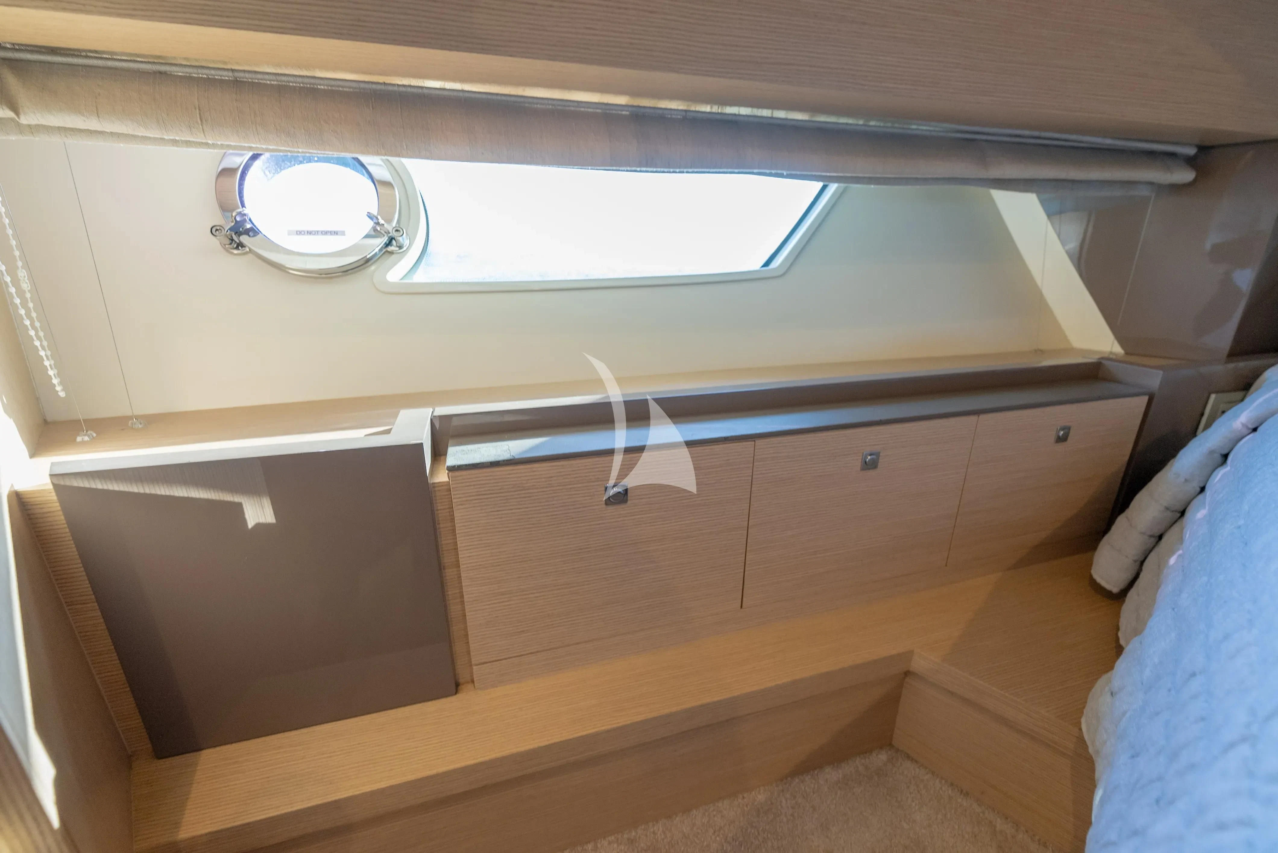 a room with a mirror and a window aboard KUDU Yacht for Sale