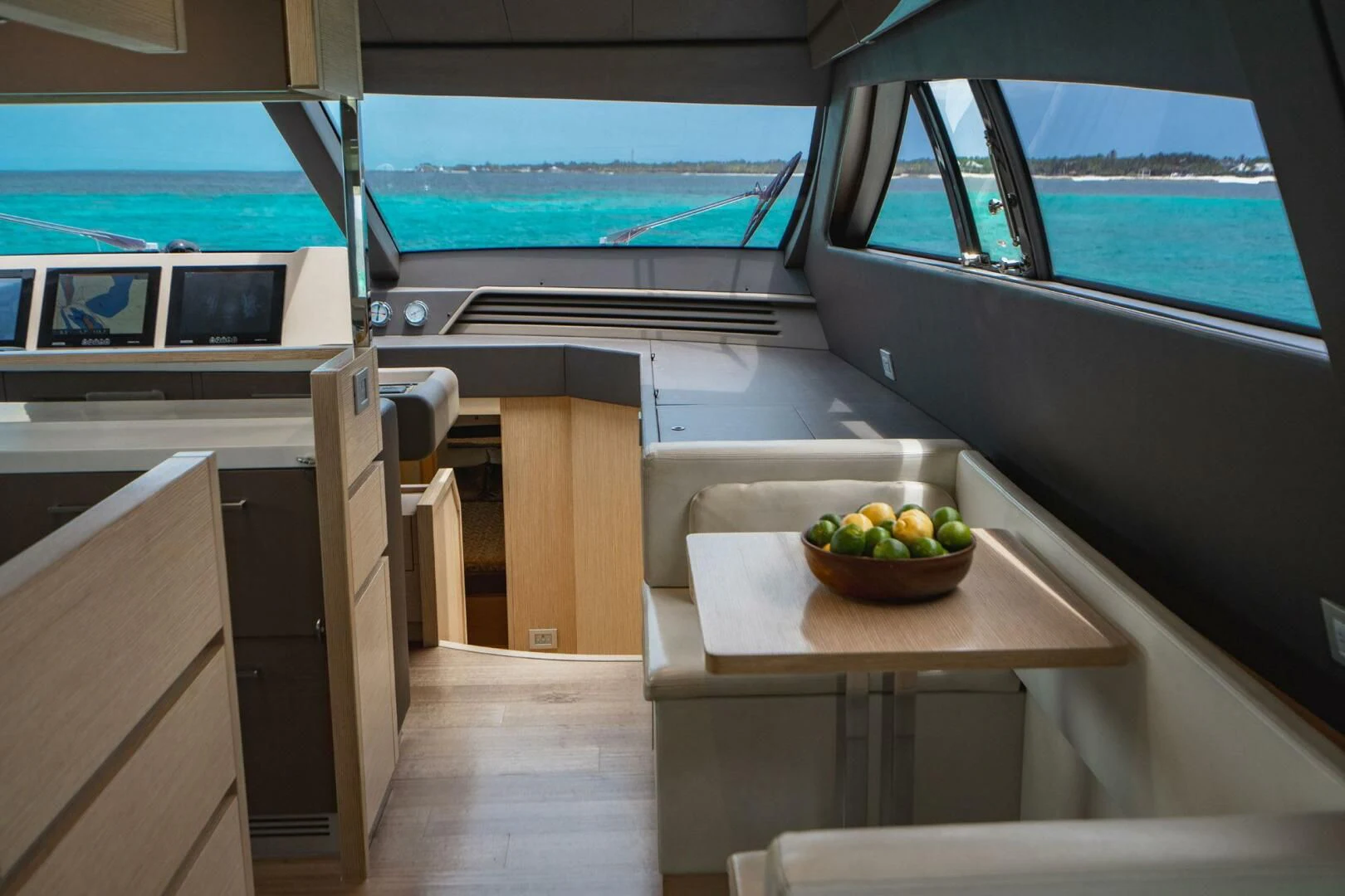 a boat with a bowl of fruit on it aboard KUDU Yacht for Sale