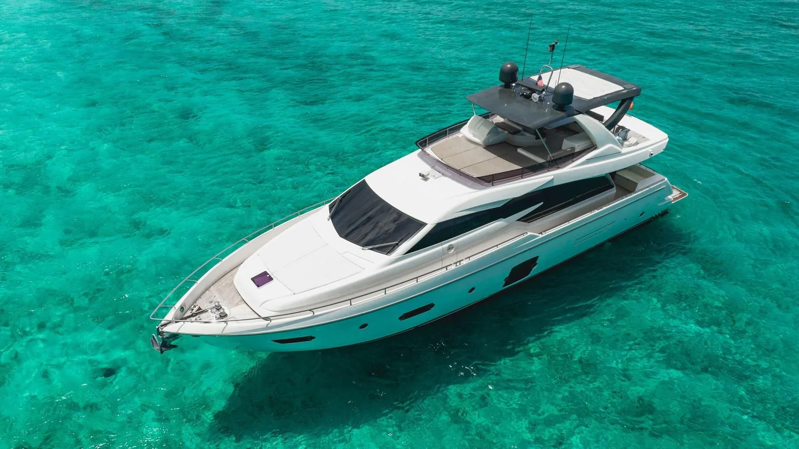 a white boat on the water aboard KUDU Yacht for Sale