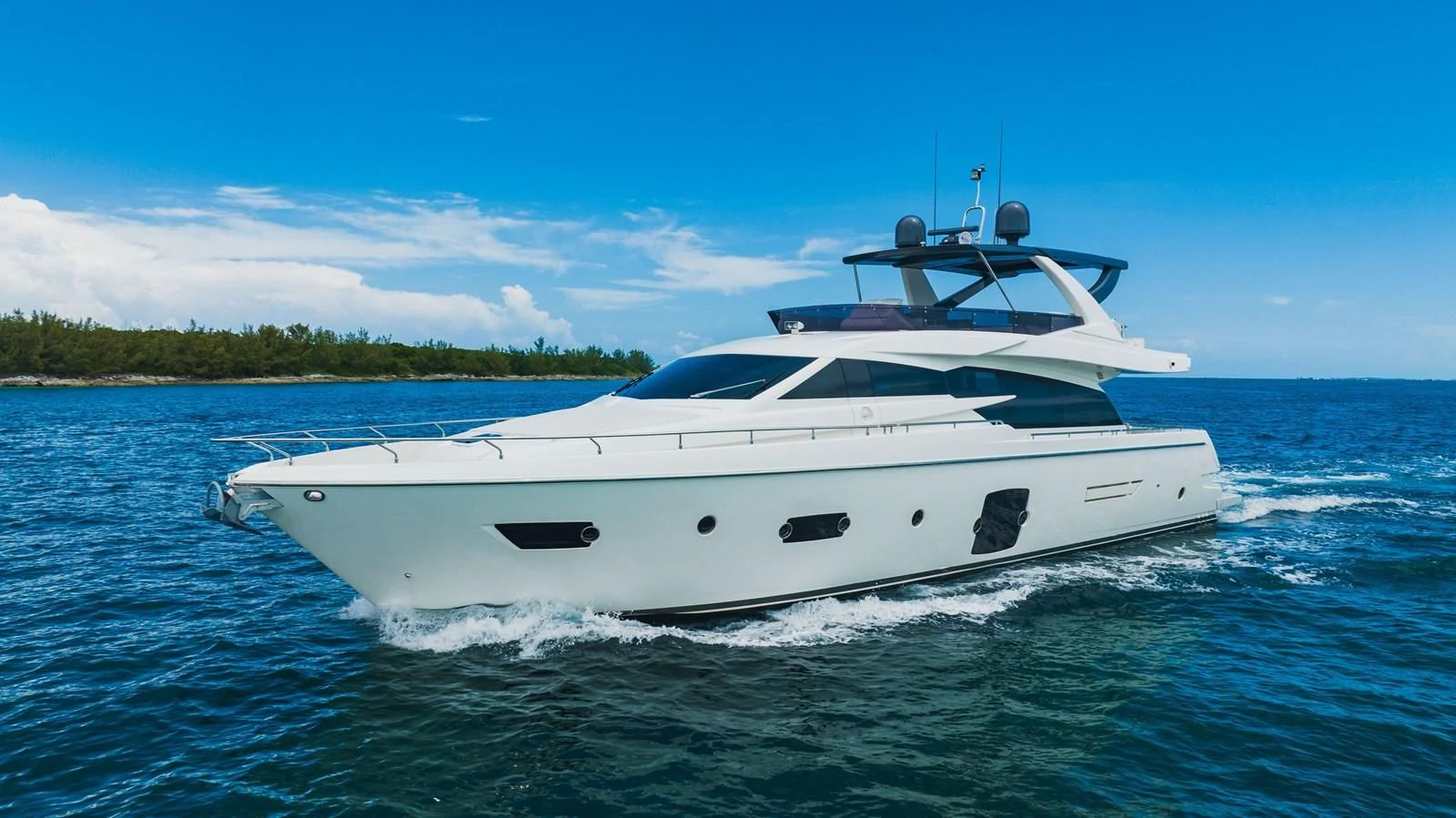 a white yacht on the water aboard KUDU Yacht for Sale