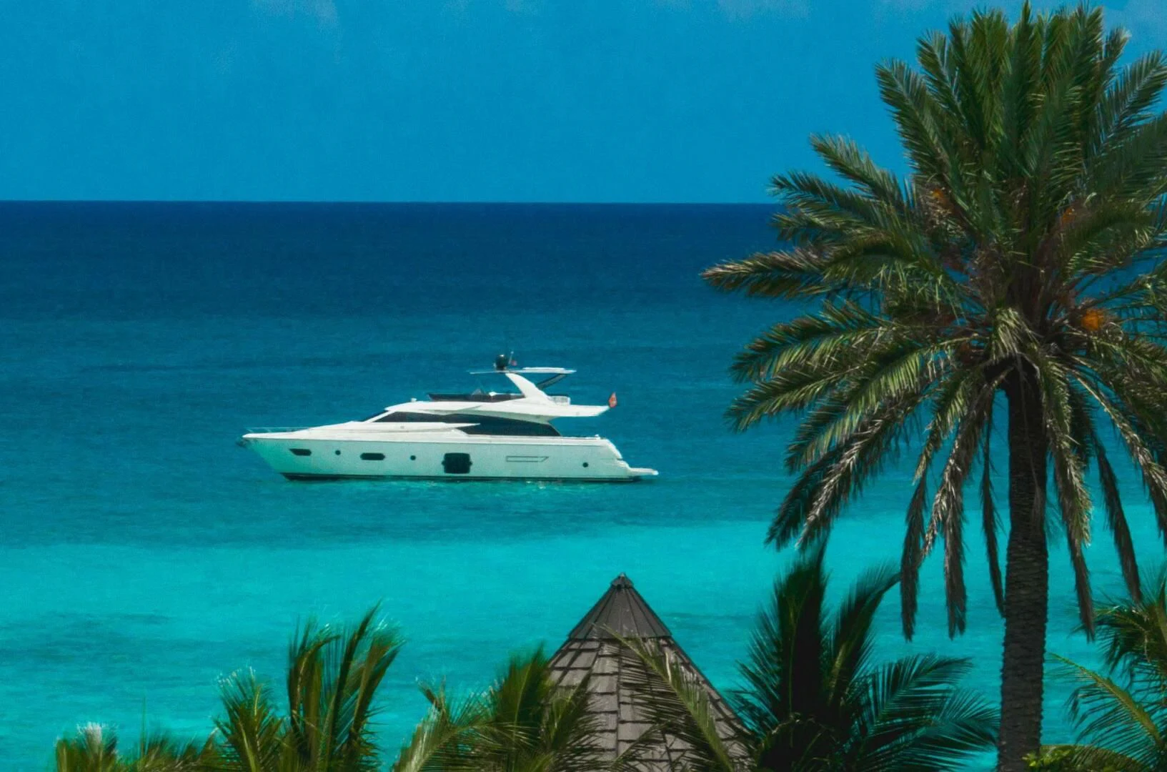 a white boat in the ocean aboard KUDU Yacht for Sale