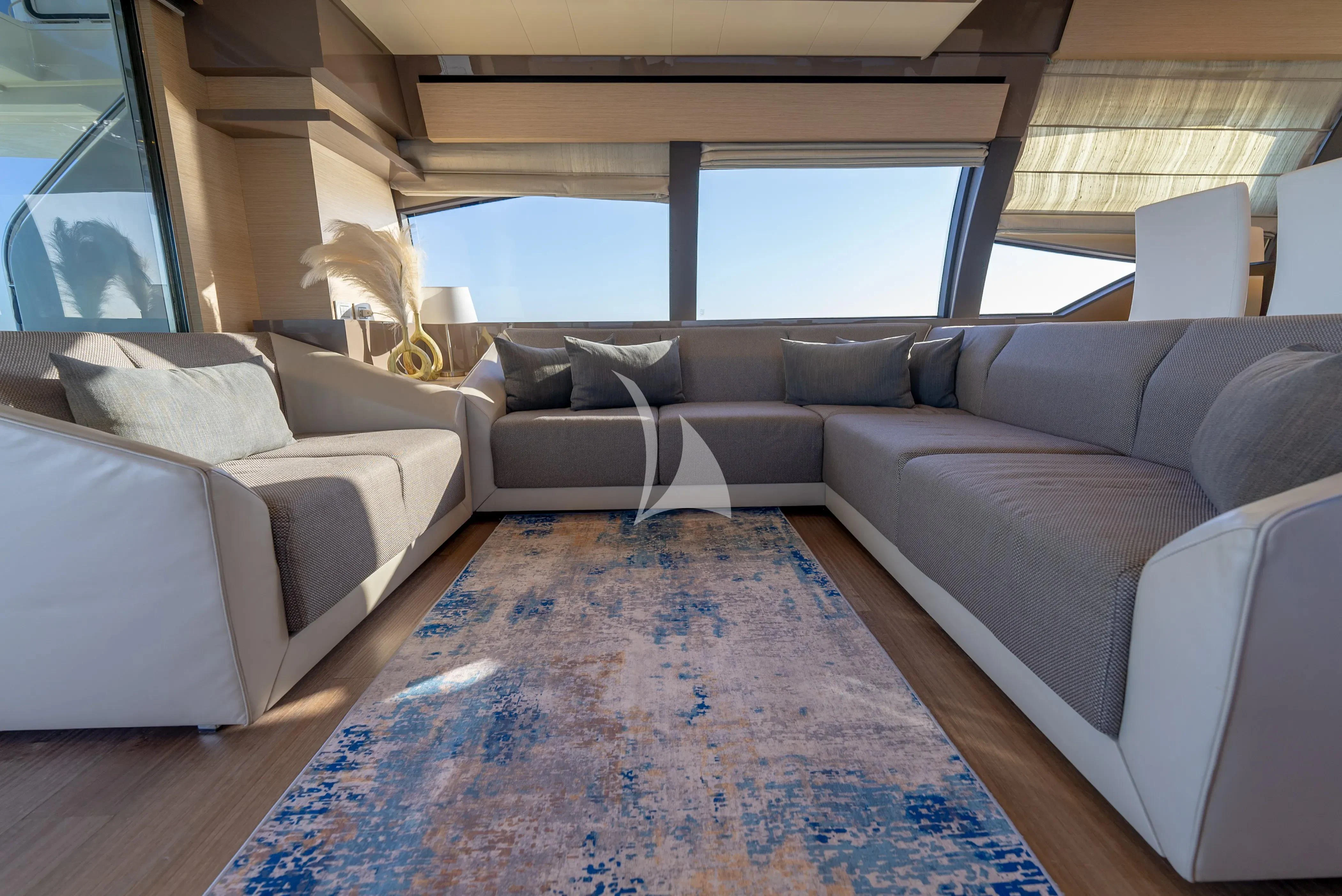 a living room with couches aboard KUDU Yacht for Sale