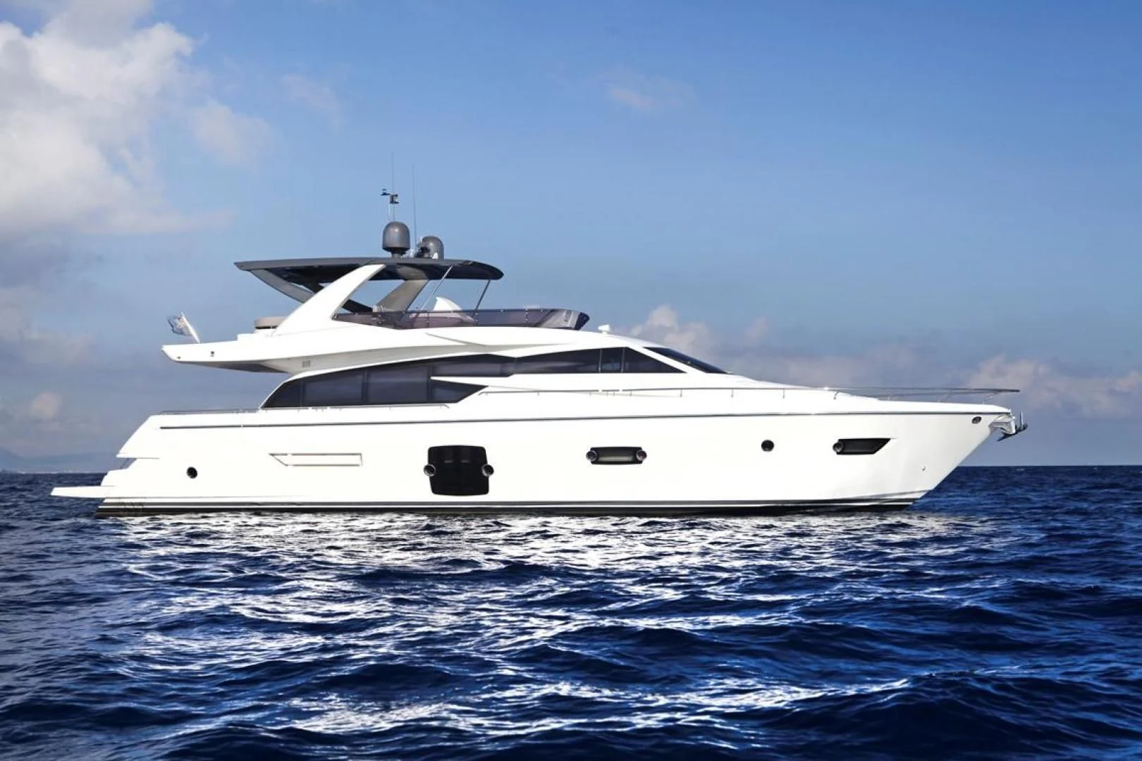 a white yacht in the water aboard KUDU Yacht for Sale