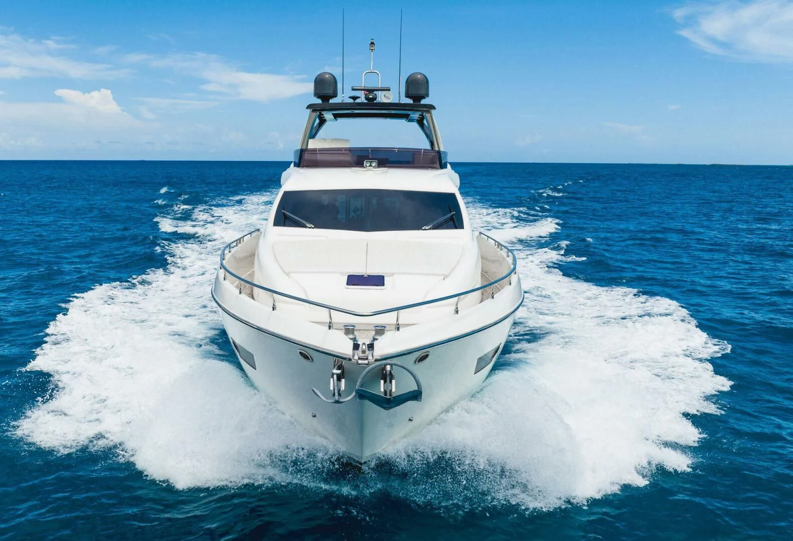 a white boat on the water aboard KUDU Yacht for Sale