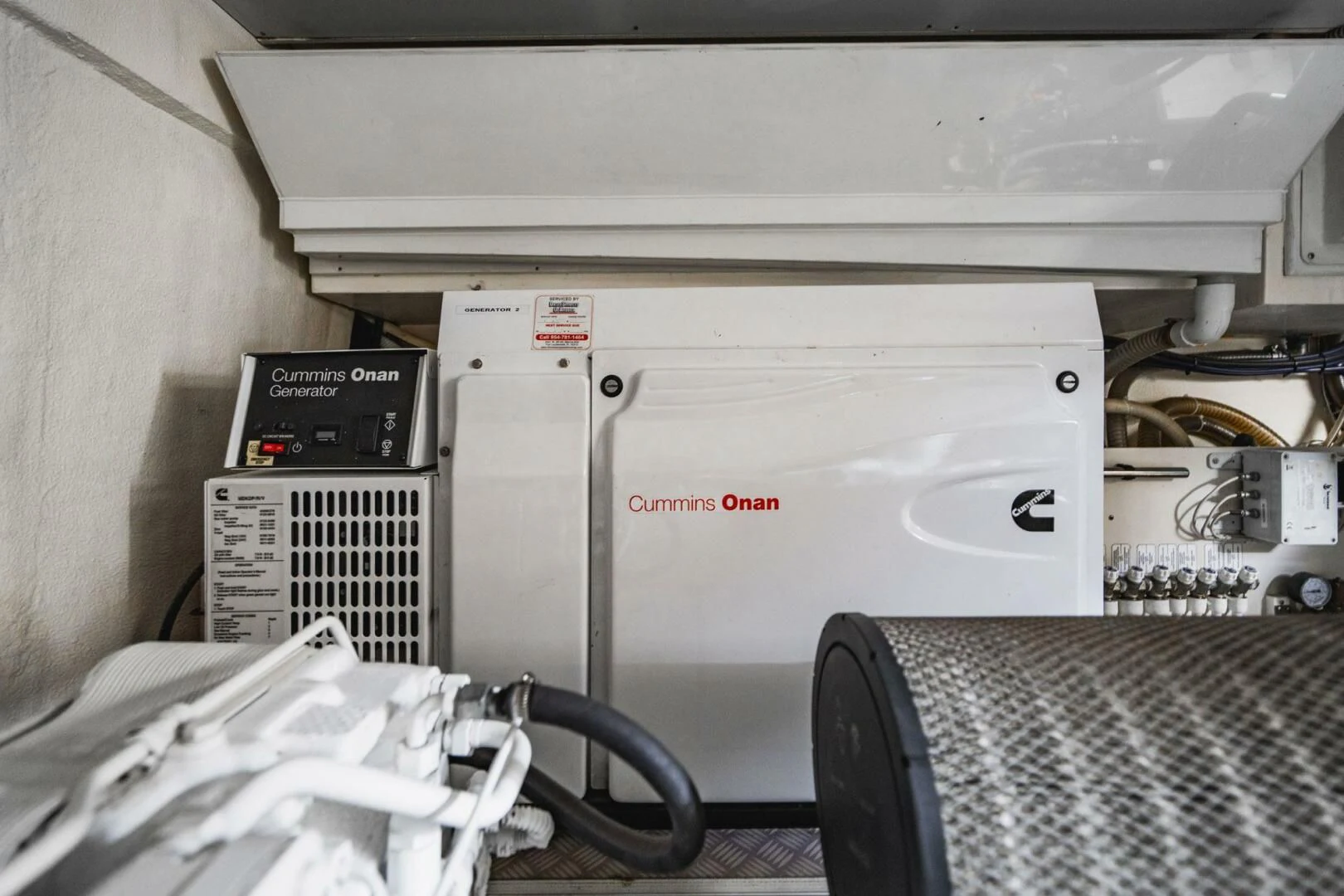 a white machine with a black handle aboard KUDU Yacht for Sale