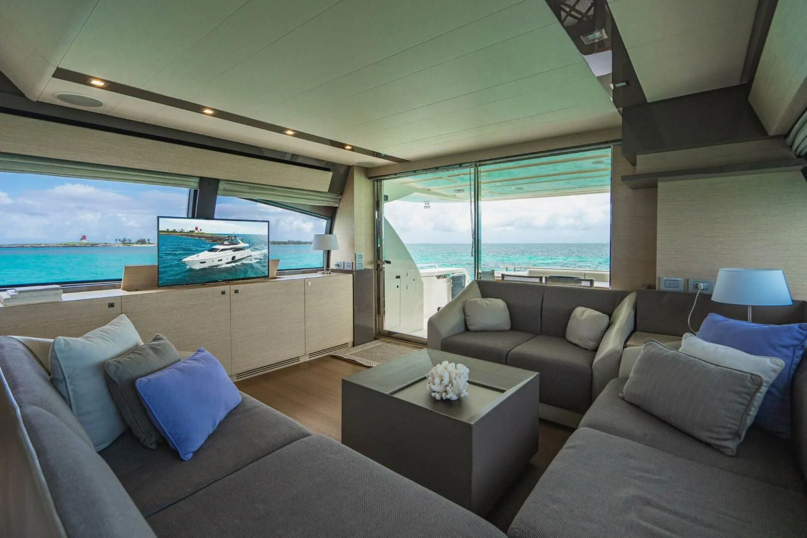a living room with a large window aboard KUDU Yacht for Sale