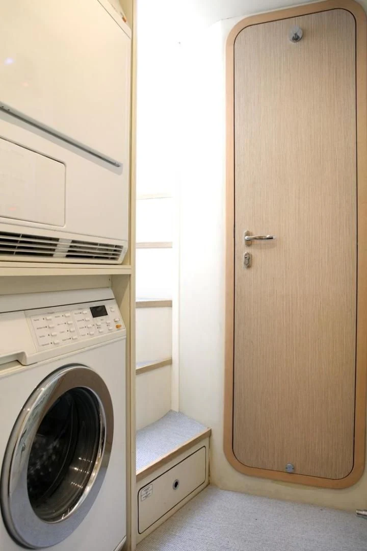 a washer and dryer in a room aboard KUDU Yacht for Sale