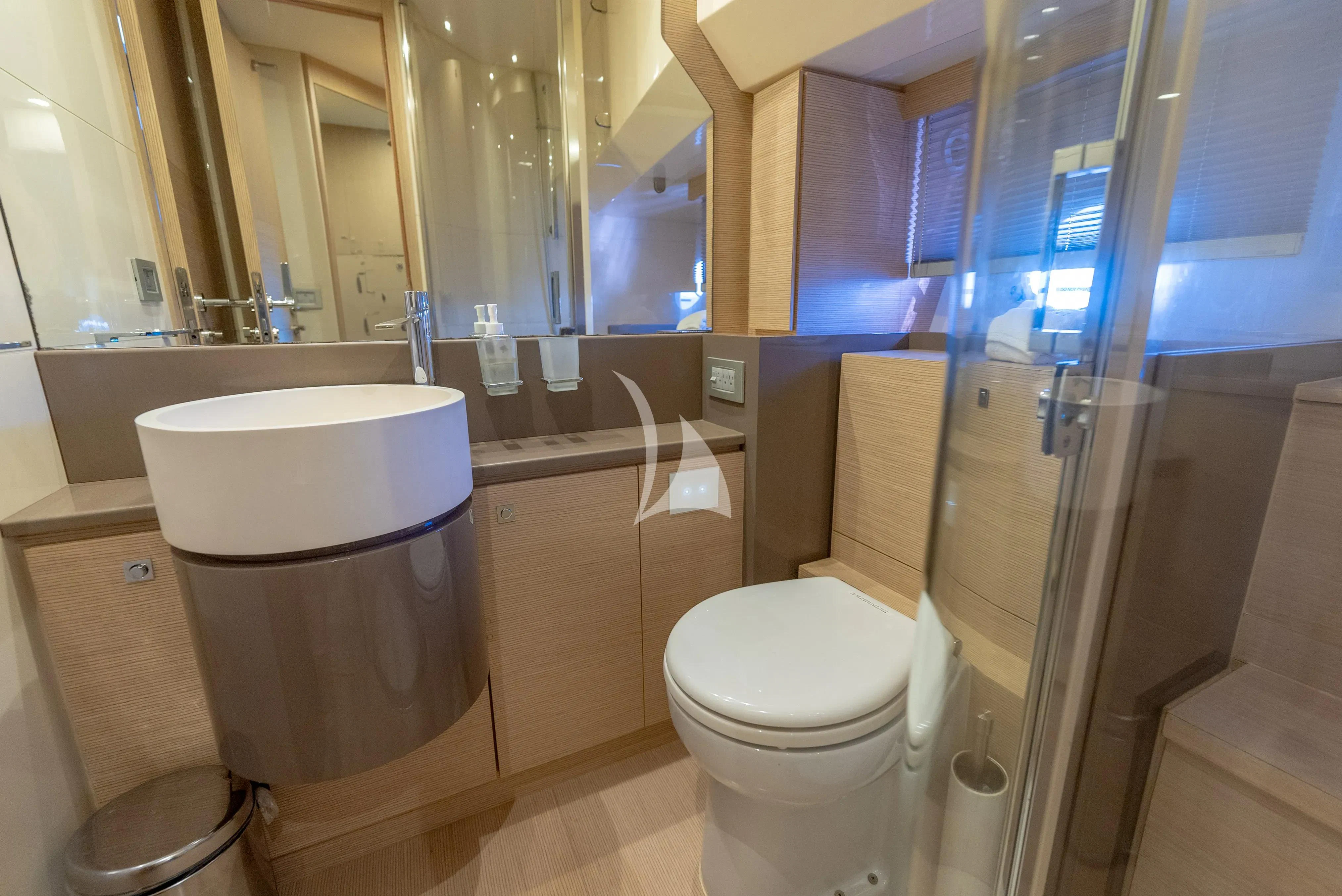 a bathroom with a glass shower aboard KUDU Yacht for Sale